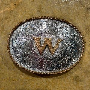 Plated Silver belt buckle. “W” in middle